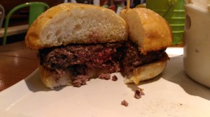 A perfect look at what a good burger looks like on the inside.